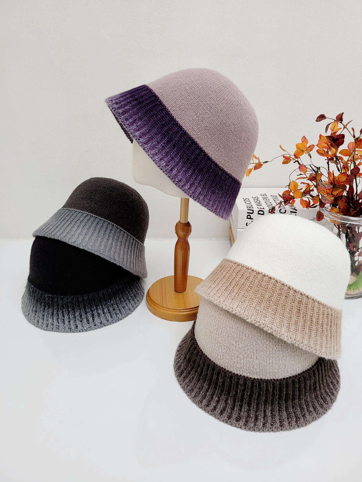 Three diana hats: lavender/purple, black/gray, & white/beige. Cozy knitted bucket hats in gradient color blocks.