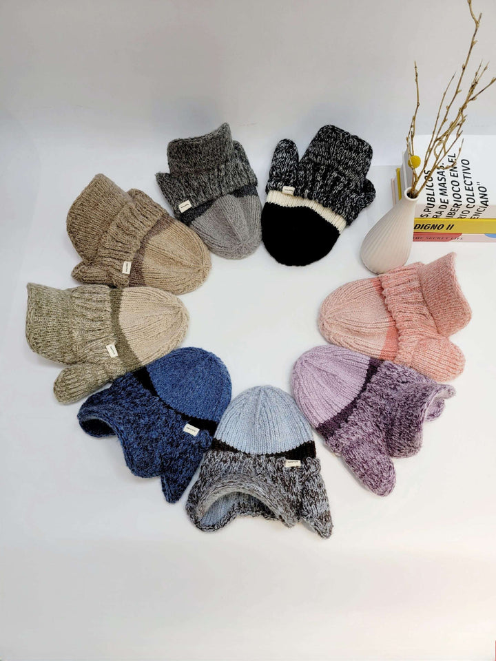 brooklyn trapper hats and mittens in a circle; knitwear in brown, gray, black, blue, purple, and pink