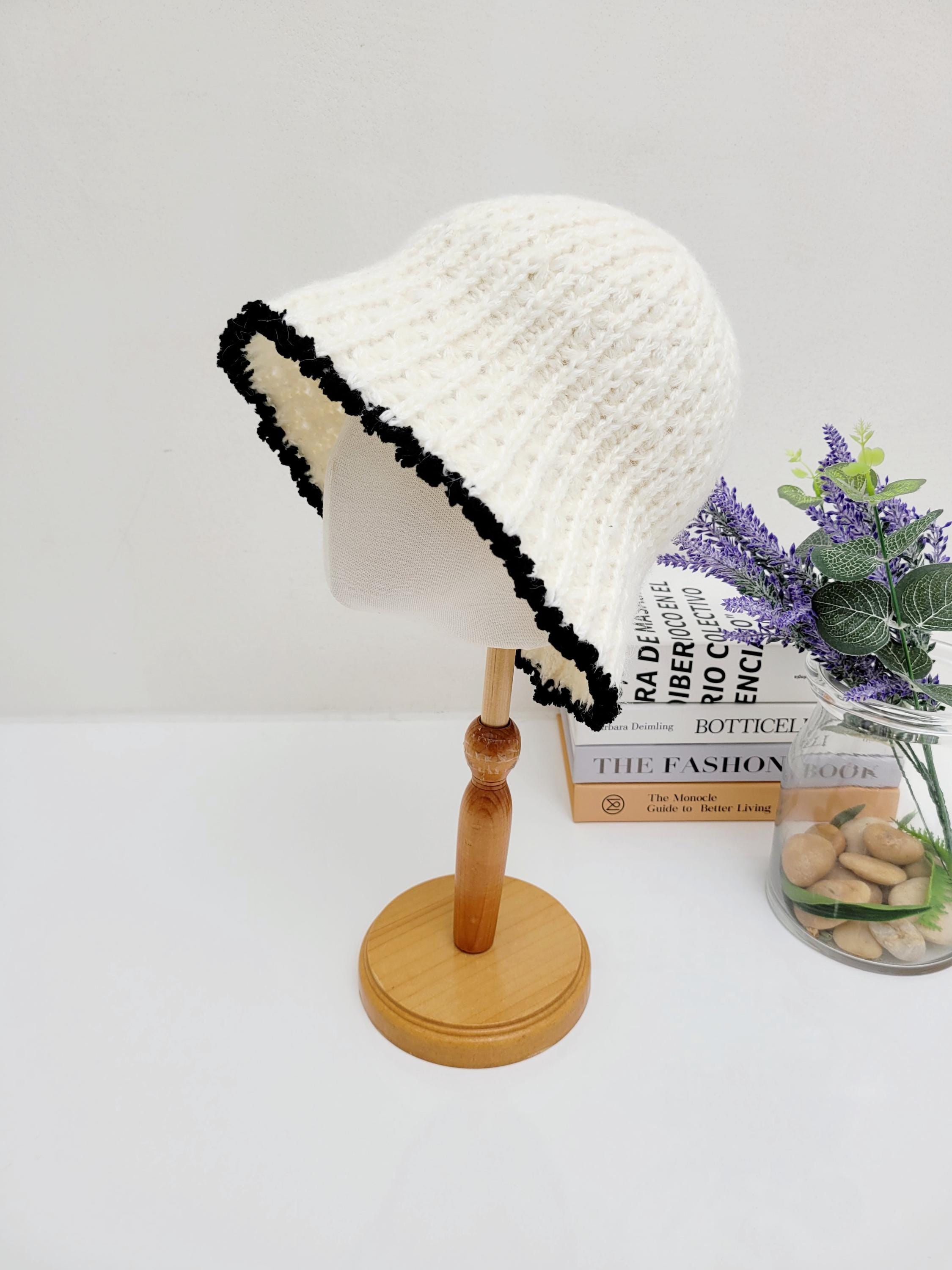 Cream-colored vintage knitted beanie with stylish black scalloped trim, a cozy & chic accessory